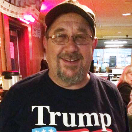 Mike Novitsky wears a MAGA hat and Trump 2020 T-shirt