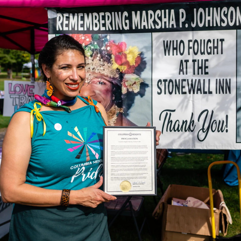 Mayor Amáda Márquez Simula holds a proclamation declaring PRIDE Day in Columbia Heights, MN.