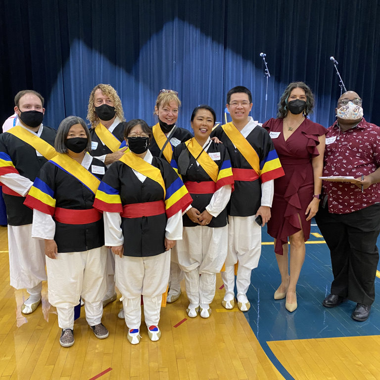 Mayor Amáda Márquez Simula poses with performers at the Columbia Heights Multicultural Festival.