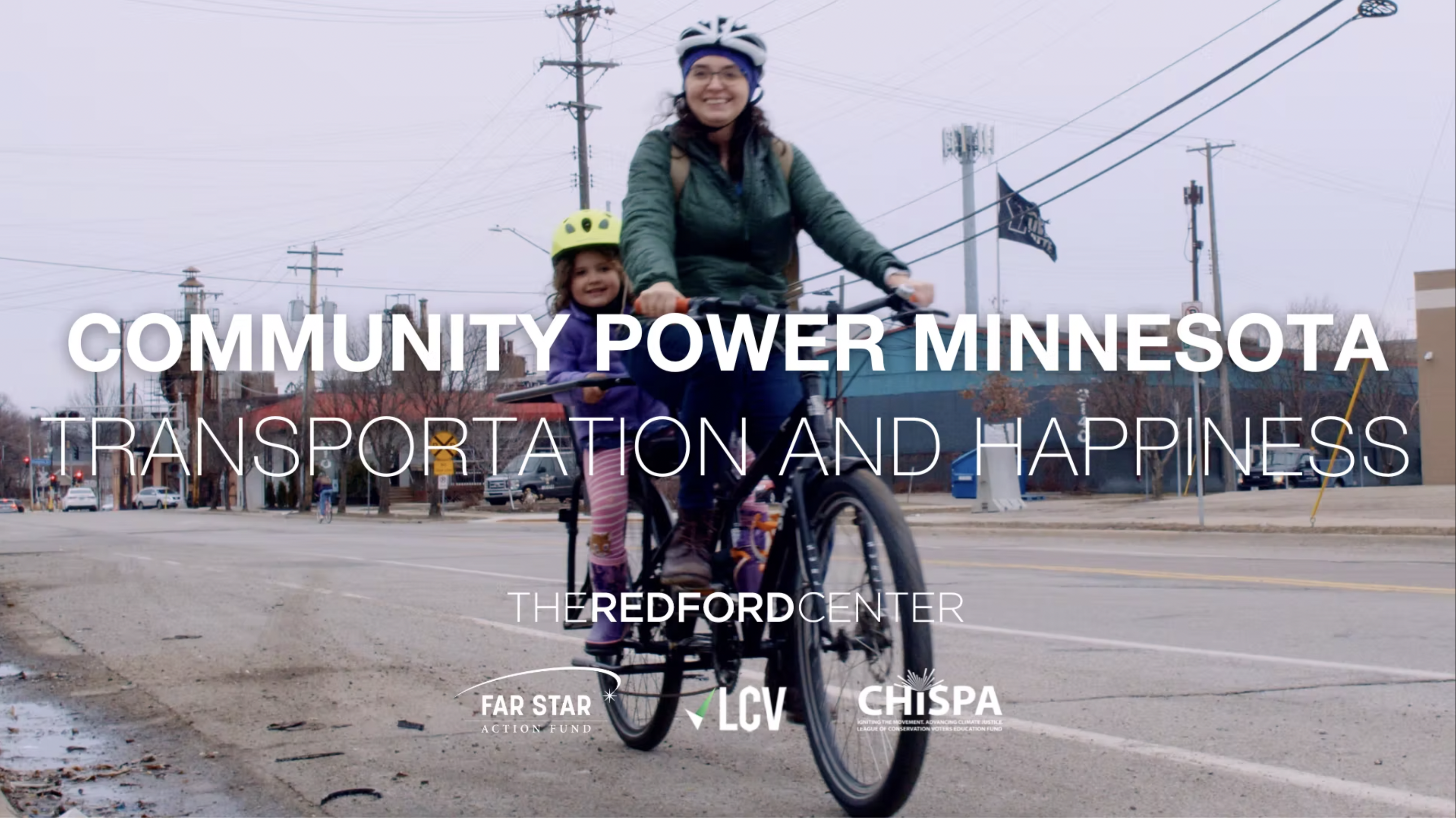 A woman rides a bike with her child - Community Power Minnesota - Transportation and Happiness - The Redford Center