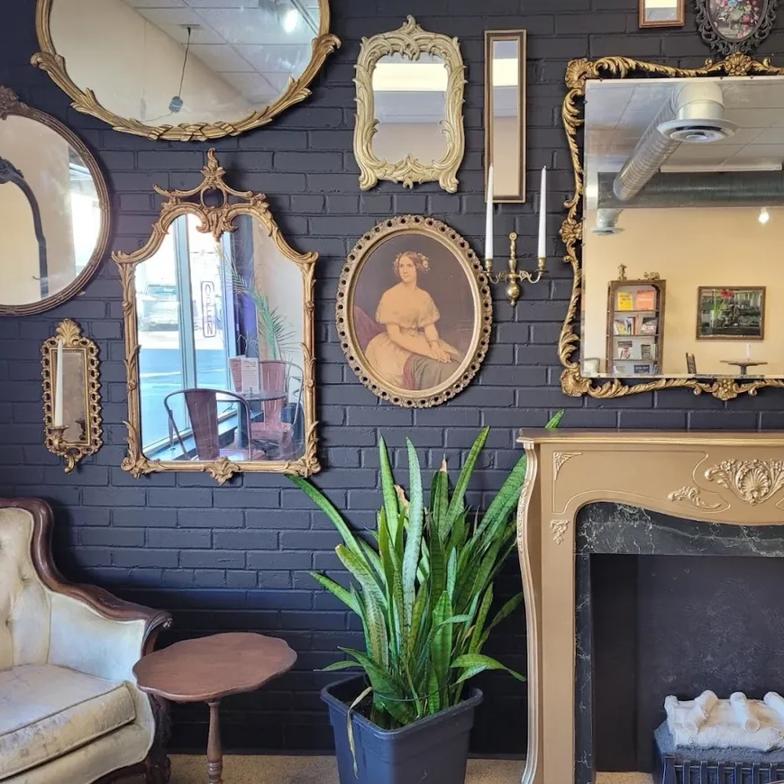 Vintage art wall and furnishings at Curiouser Foods in St. Anthony, Minnesota